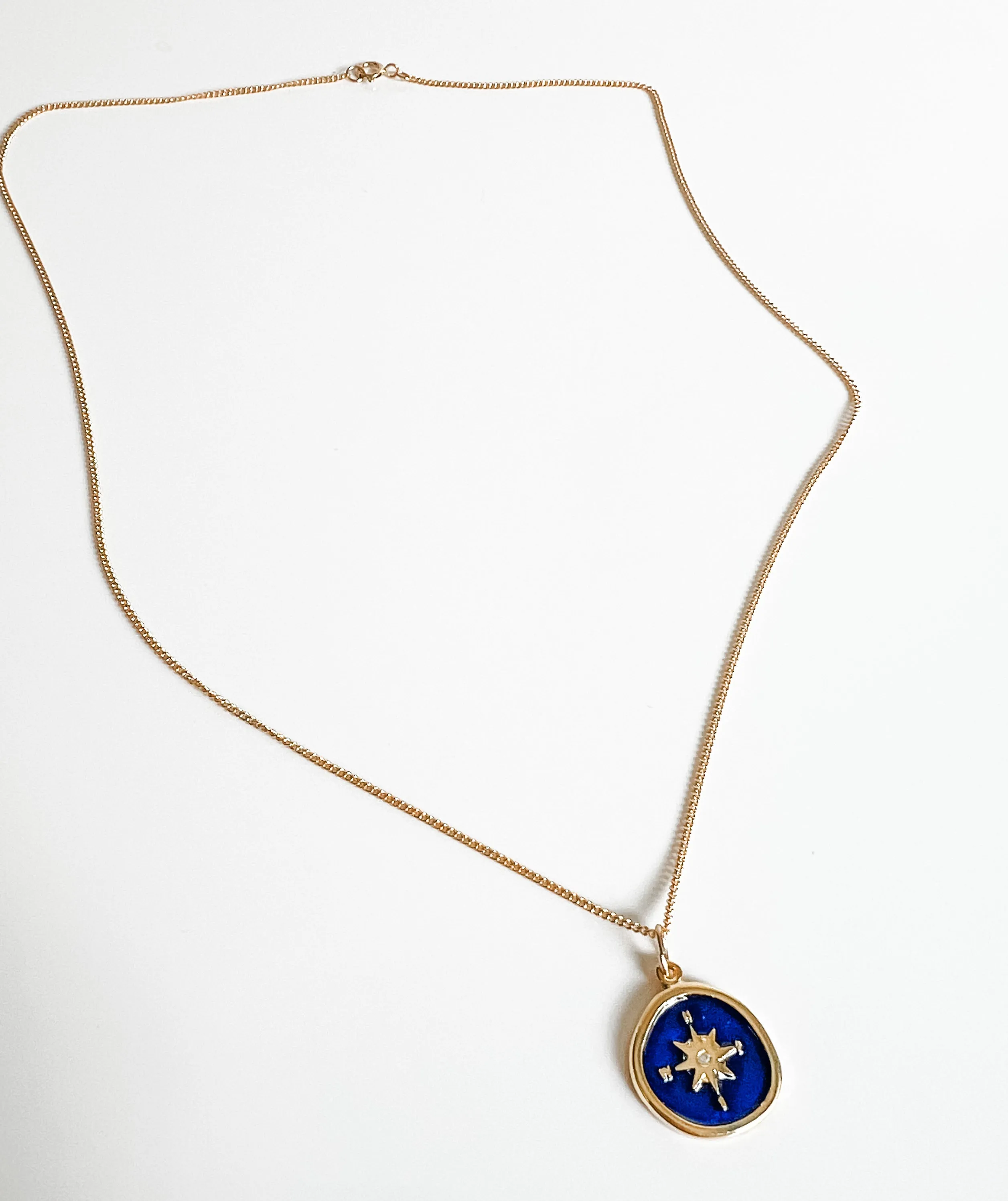 Blue enamel compass charm