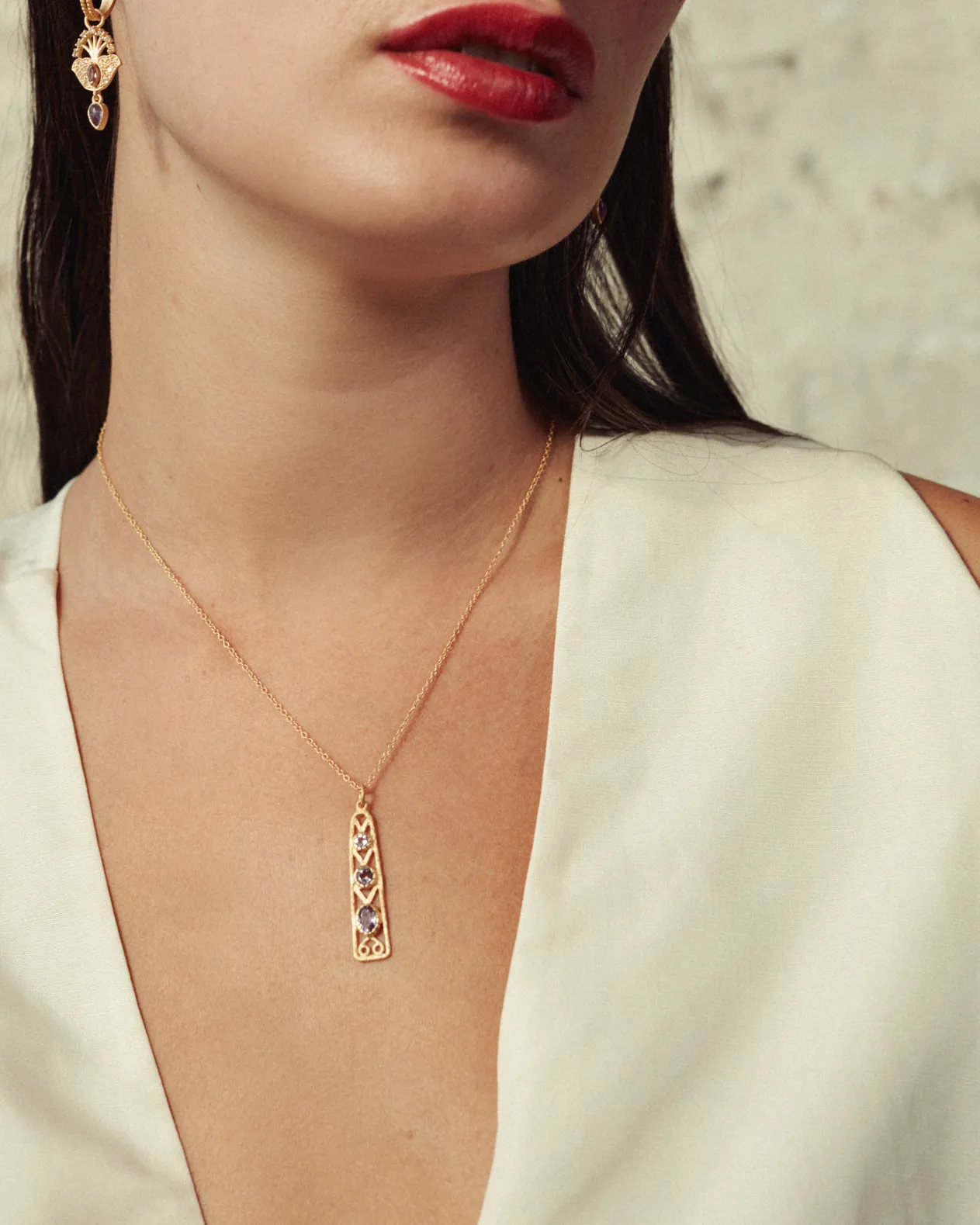 Delta pendant with blue topaz