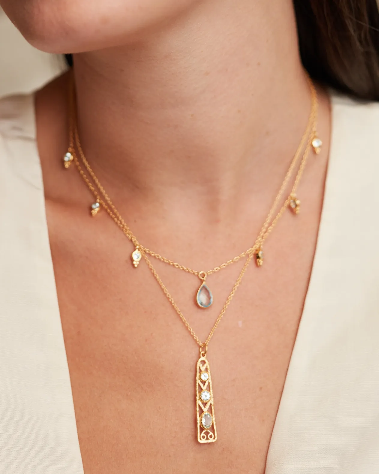 Delta pendant with blue topaz