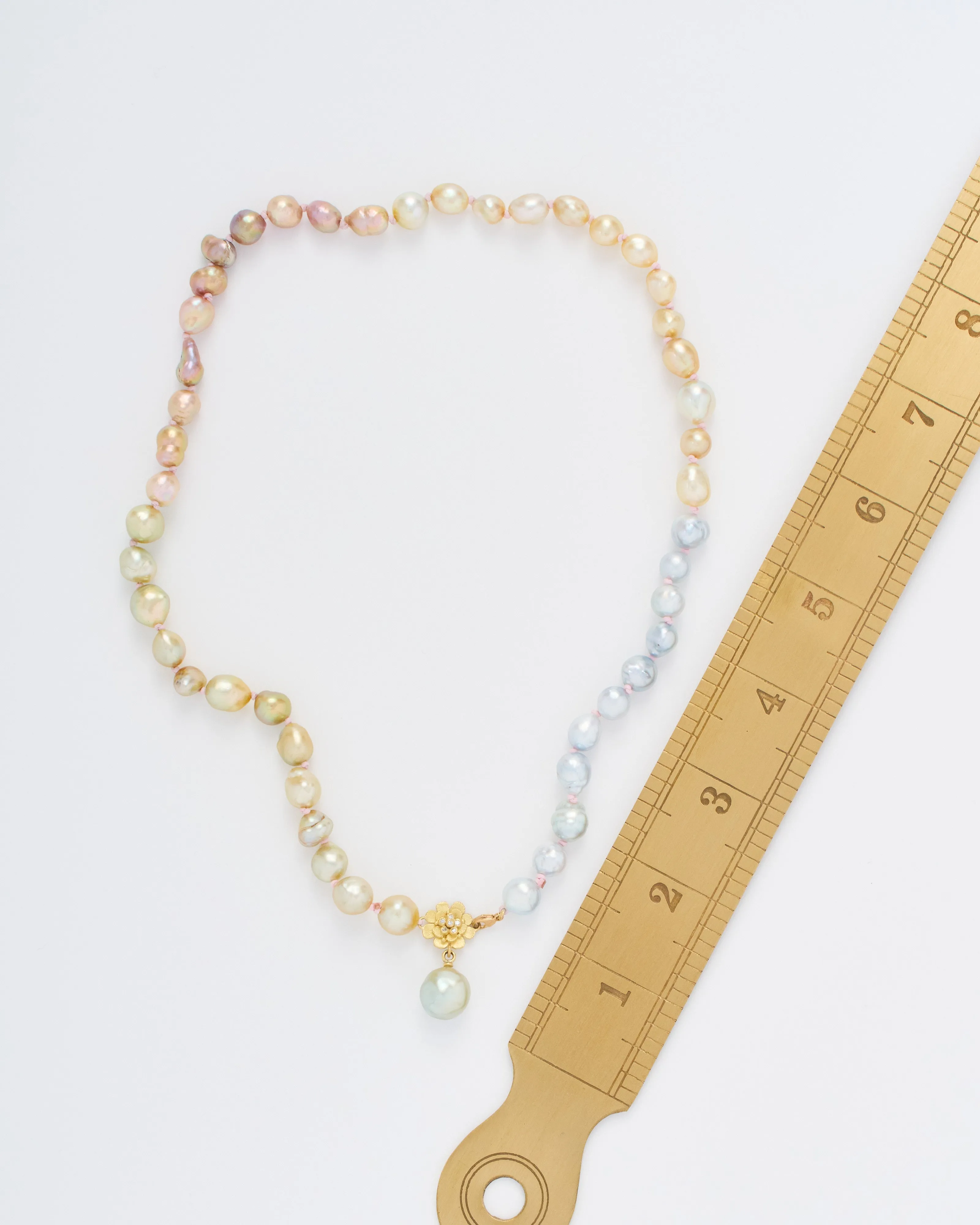 pearl necklace with flower and diamonds