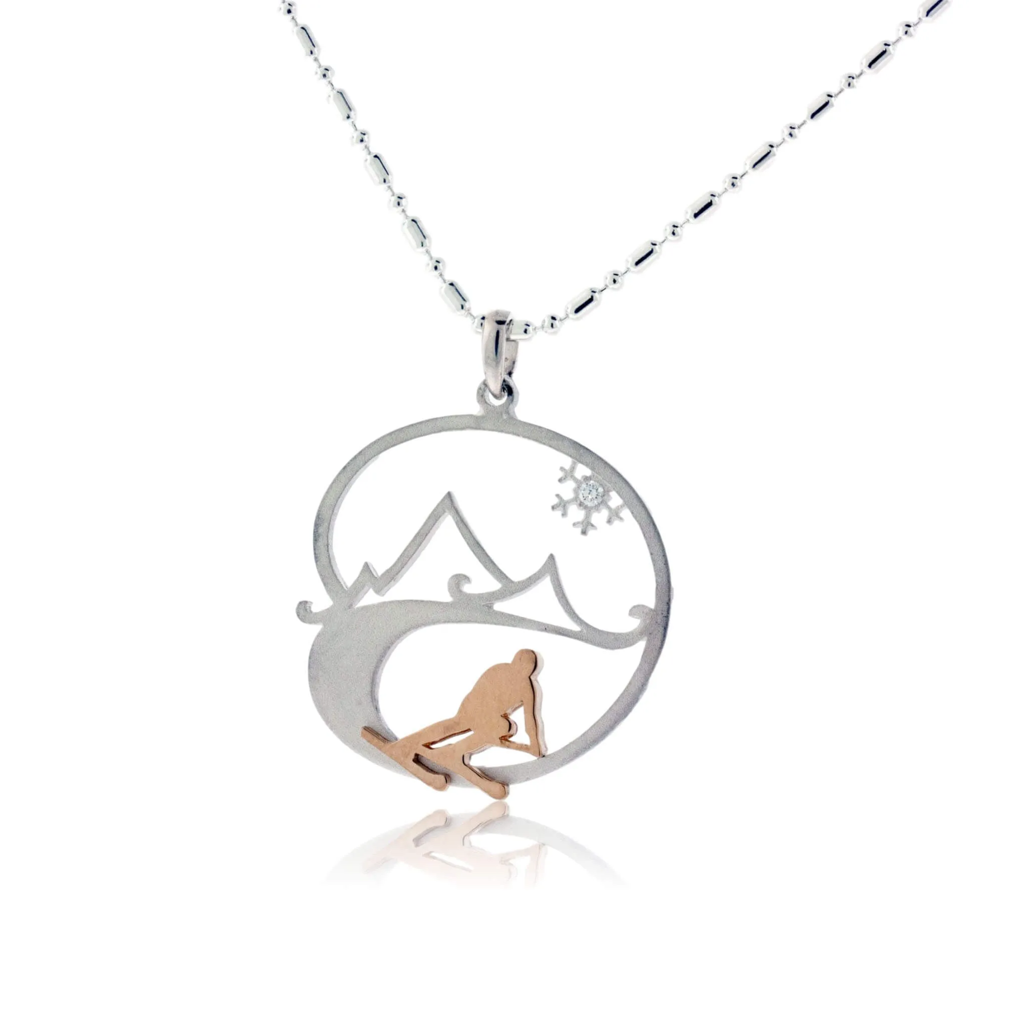 Skier in the Mountains with Snowflake Pendant