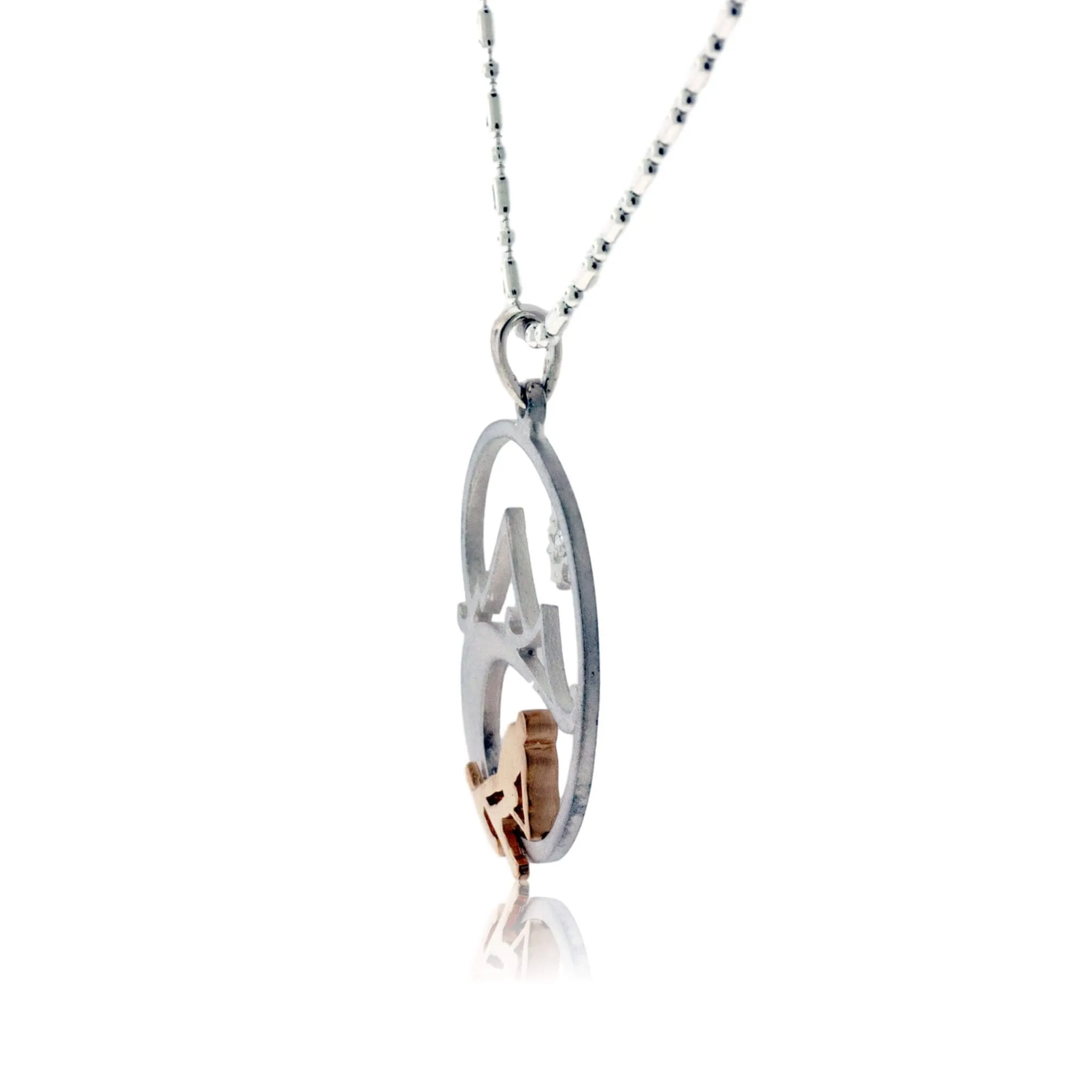 Skier in the Mountains with Snowflake Pendant