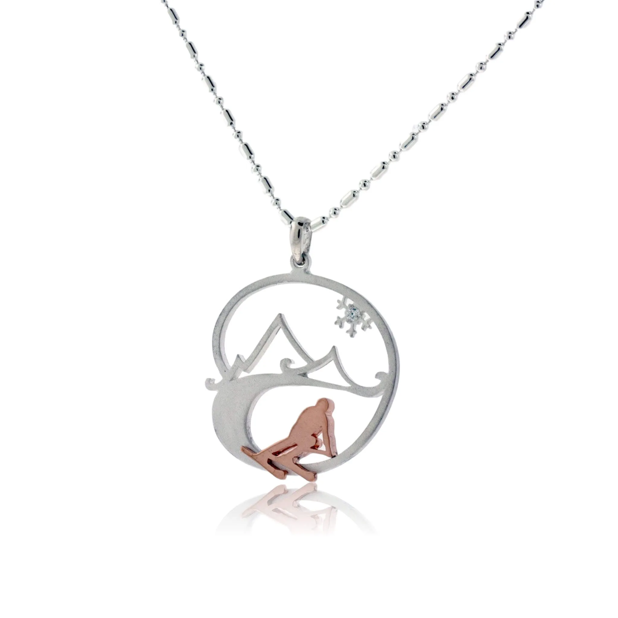 Skier in the Mountains with Snowflake Pendant