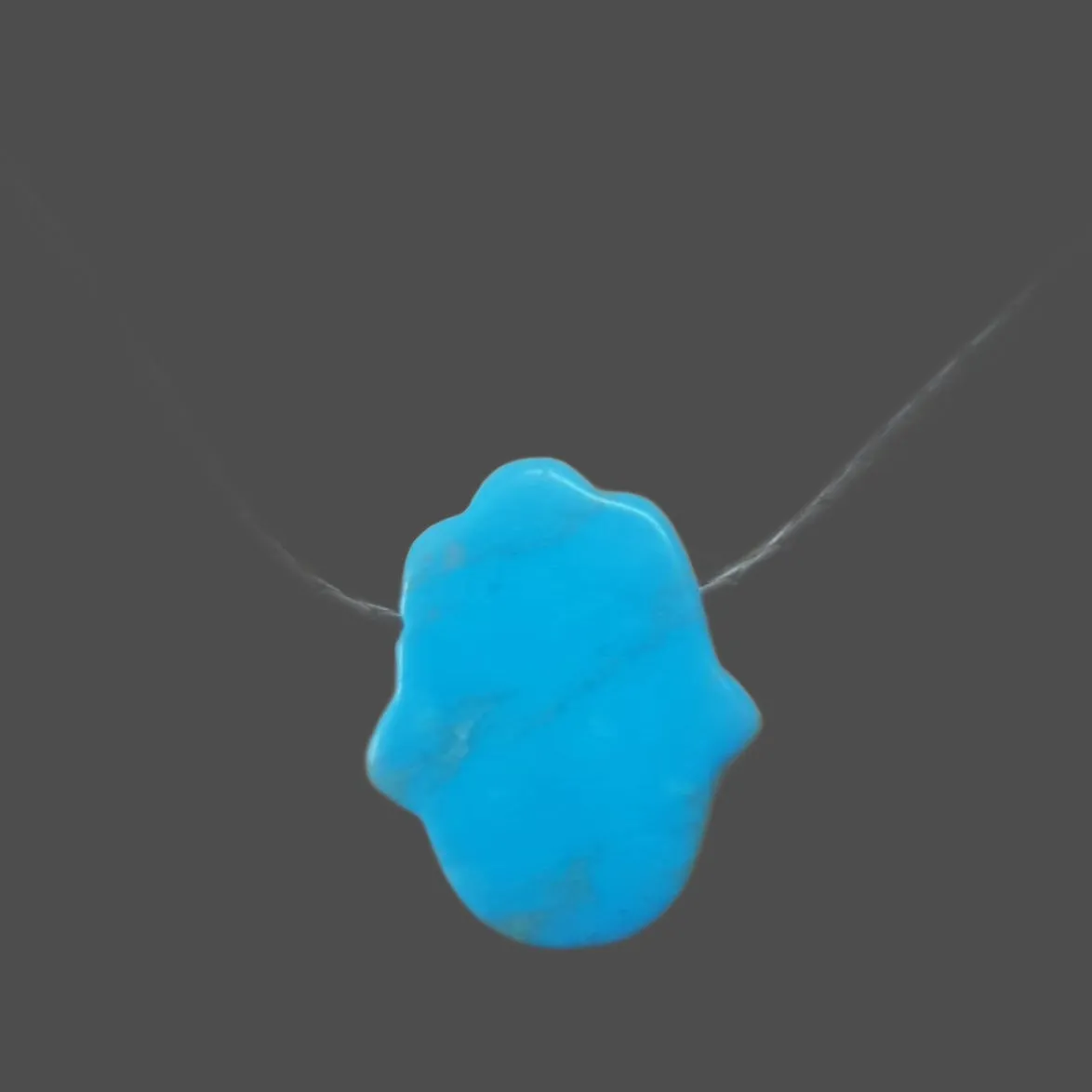 Sterling silver chain pendant with a turquoise hamsa